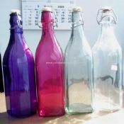 Multi color glass bottle with zinc ring and plastic top images