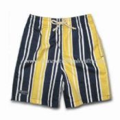 Boys Board Shorts with All-over Prints Two Side Pockets and One Rubber Badge on Right Leg images