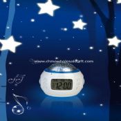 Alarm calendar clock with moving star projection light images