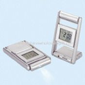 Multifunction LCD Clock Featuring with Thermometer Calendar Alarm FM Radio and Torch images