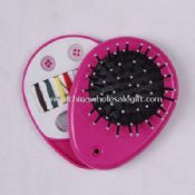 Cosmetic mirror with brush and sewing kit images