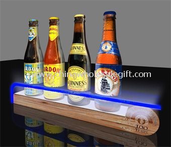 LED wine display with wooden pedestal