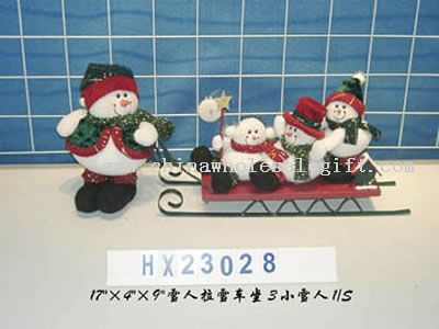 snowman with 3 little snowman on the sleigh