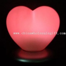 Single LED que cambia de color el corazón ligero con base de carga images