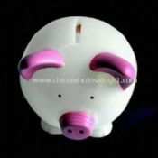 Glødende gris-formet mynt Bank med LED og bytte images