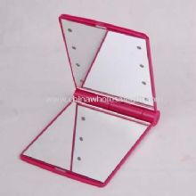 Cosmetic mirror with light images