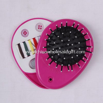 Cosmetic mirror with brush and sewing kit