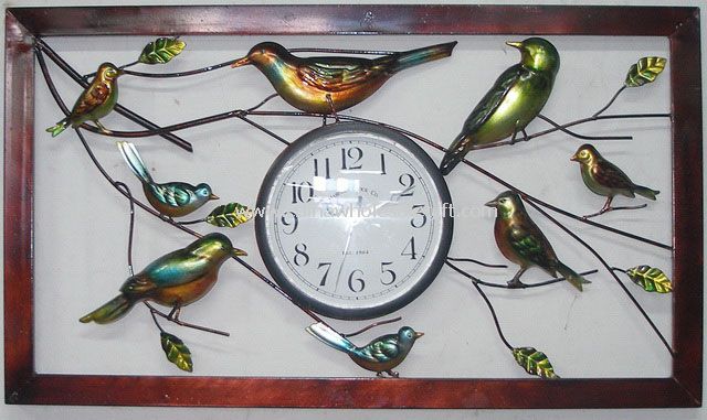 kovové hodiny ptáci