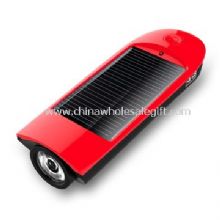 Solar mobile phone charger with flashlight images